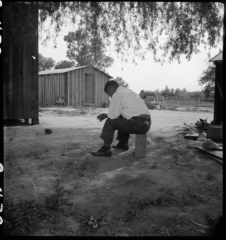 Woodland, California. Tenant farmer of Japanese ancestry who has just completed settlement of their affairs and everything is packed ready for evacuation on the following morning to an assembly center.