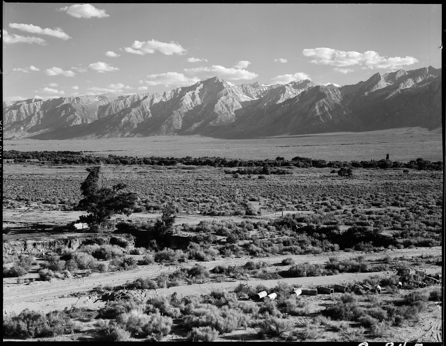 Manzanar Relocation Center, Manzanar, California. A view of surrounding country flanked by beautiful mountains at this War Relocation Authority center.