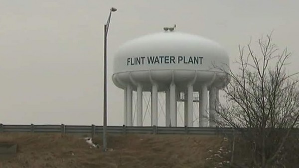 Four more officials charged in Flint water crisis