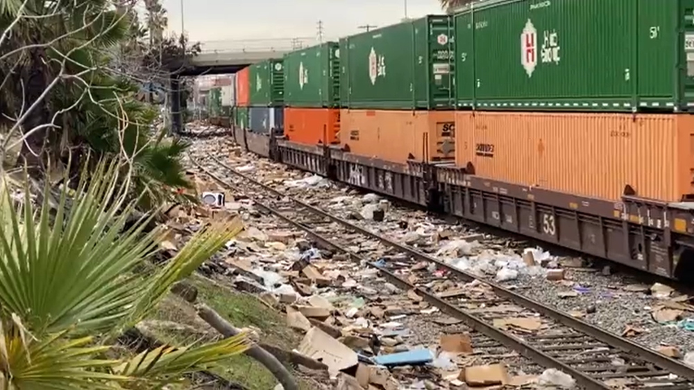 Shocking photos show sea of discarded boxes from train robberies as thieves steal items bound for consumers, worsening supply chain crisis